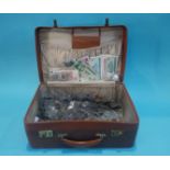 A large case of coins and bank notes