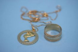 An 18ct gold pendant and chain, stamped 750 and a ring stamped 750, weight 17.6 grams