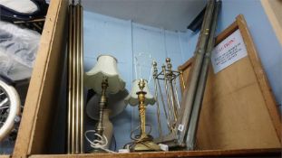 A fender, fire irons and brass lamps etc.
