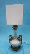 An Ornate gilt metal table lamp