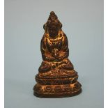A small gilt bronze Buddha. 8cm high