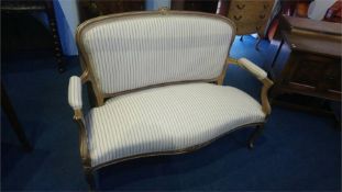 A gilt French style two seater settee