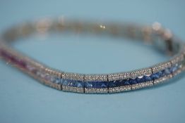 An 18ct white gold bracelet, set with diamond and colourful semi precious stones, total weight 18.