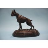 A reproduction bronze model of a standing dog