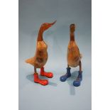 A pair of wooden ducks