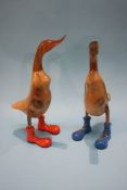 A pair of wooden ducks