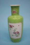 A Chinese famille rose vase, on a lime green ground. 25cm high