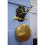 A hanging brass dinner gong
