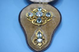 An impressive Victorian brooch of yellow metal, set with seven aquamarine coloured stones, in