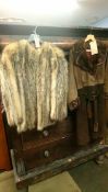 A Possum skin coat and another