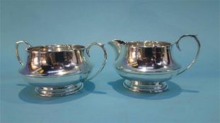 A silver cream jug and silver bowl, weight 151 grams / 4.8oz
