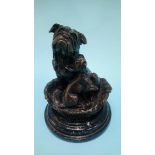 A small reproduction bronze of a bulldog and puppy in a basket