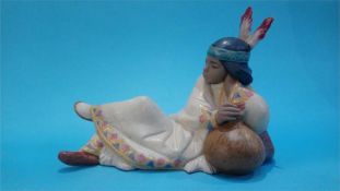 A Lladro figure of a resting Indian woman, (with box)
