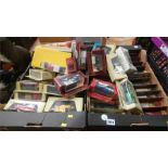 Two boxes of boxed model cars