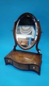 A 19th century mahogany serpentine fronted dressing table mirror
