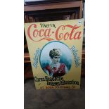 A modern enamel Coca Cola sign