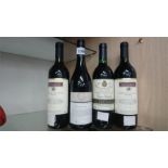 Four bottles of red wine