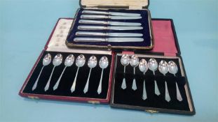 Two sets of six silver teaspoons and a set of six silver handled tea knives