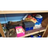Shelf of assorted, snooker cue, clothes and life jacket etc.