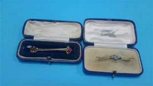A 9c t gold bar brooch and three tie pins