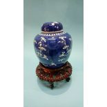A Chinese blue and white ginger jar and cover with a wooden stand (2)
