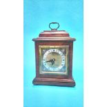 A walnut cased Elliott of London clock for Garrard and Co Limited, 112 Regent Street London, 19cm
