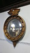 A walnut framed mirror and a gilt convex mirror (2)