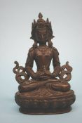 A bronze figure of a Buddha. 16cm high