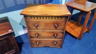 An oak chest of three drawers, 61cm wide