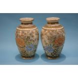 A pair of Satsuma vases each decorated with chrysanthemums, signed to base, 31cm height