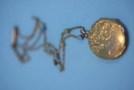 A 9ct gold engraved pendant and chain, weight 11.1 grams
