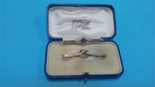 A 9ct gold bar brooch inset with amethyst and another bar brooch, total weight 5.4 grams