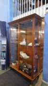 A large and impressive pine shop display cabinet, with three glass shelves, 132cm wide, 215cm high