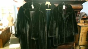 Three fake fur coats
