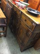 A Goodwin and Titchmarsh style oak sideboard
