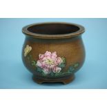 A famille rose pot, with marks to base. 9cm high