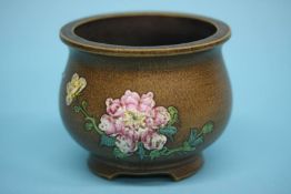 A famille rose pot, with marks to base. 9cm high