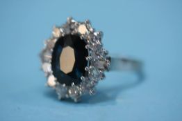 An 18ct white gold sapphire and diamond ring, the 12 diamonds approx. 2.05ct, colour H-J, clarity