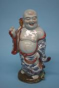 A standing figure of a Buddha. 30cm high