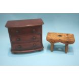 A small cracket and a miniature mahogany bow front three drawer chest of drawers, 32cm wide