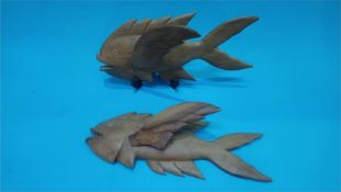 A pair of carved wood Pitcairn Island fish by Henry Young, 32cm wide