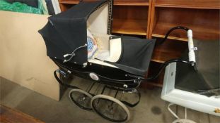 A Silver Cross dolls pram