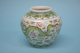 A Chinese Douai jar, decorated with dragons, with six character mark to base. 12.5cm high