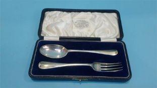 A cased silver christening spoon and fork