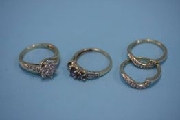 A 9ct gold and diamond cluster ring (bridal set), two Eternity rings and a 9ct gold ring (4). (