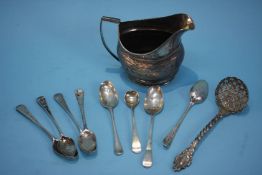 A Georgian silver cream jug, Newcastle (marks rubbed) and various silver spoons, weight 272.9