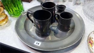 Pewter charger and four tankards
