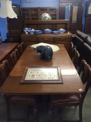 An oak Lees type dining room suite comprising, sideboard, table and six chairs