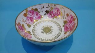 A Royal Crown Derby bowl decorated with roses, numbered 0664, 24cm diameter