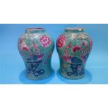 A large pair of Chinese vases decorated on a sage ground with peacocks and chrysanthemums, 36cm